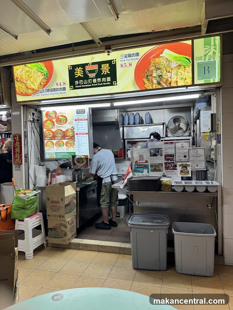 Food stall interior with signage and staff