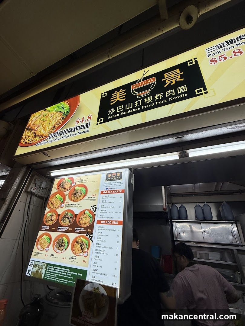 Food stall interior with signage and staff