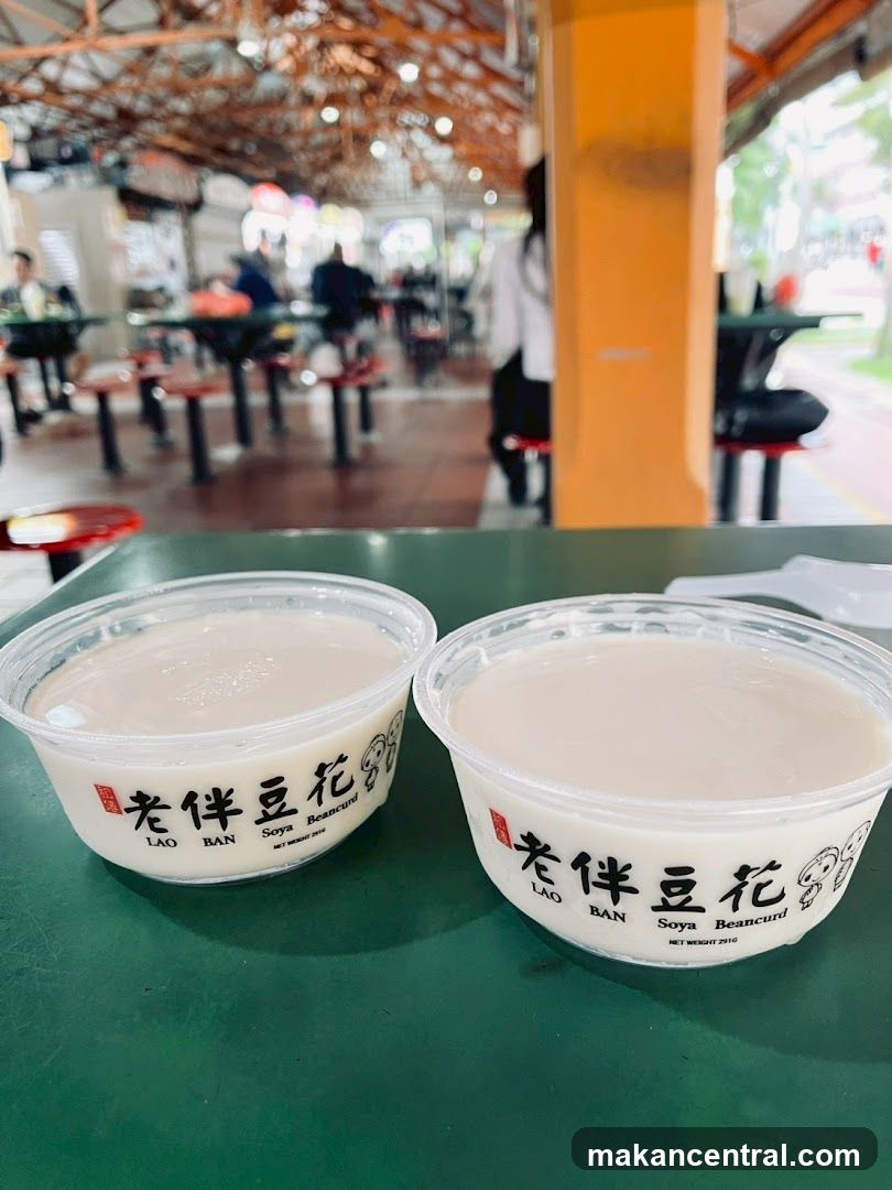 Two Soya Beancurd Cups on Green Table