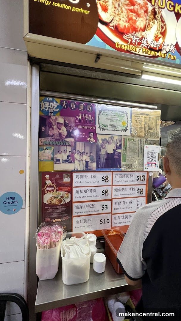 Food stall interior with menu board and customer