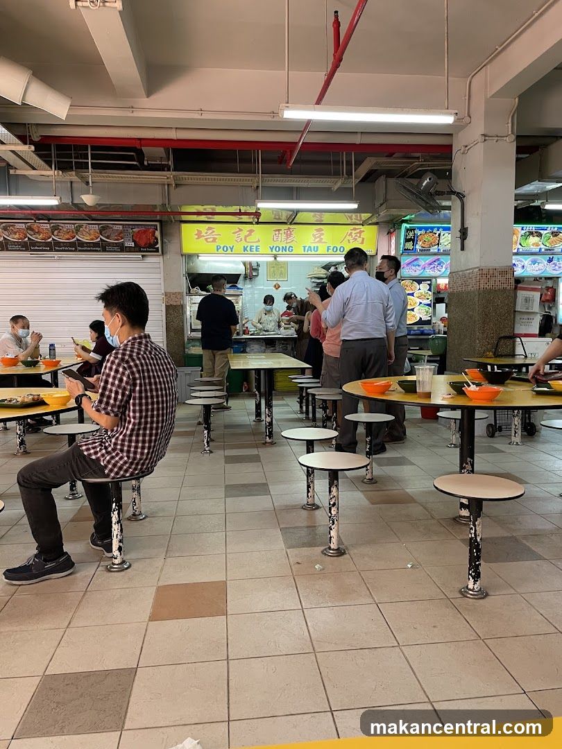 Food court interior with diners and stall