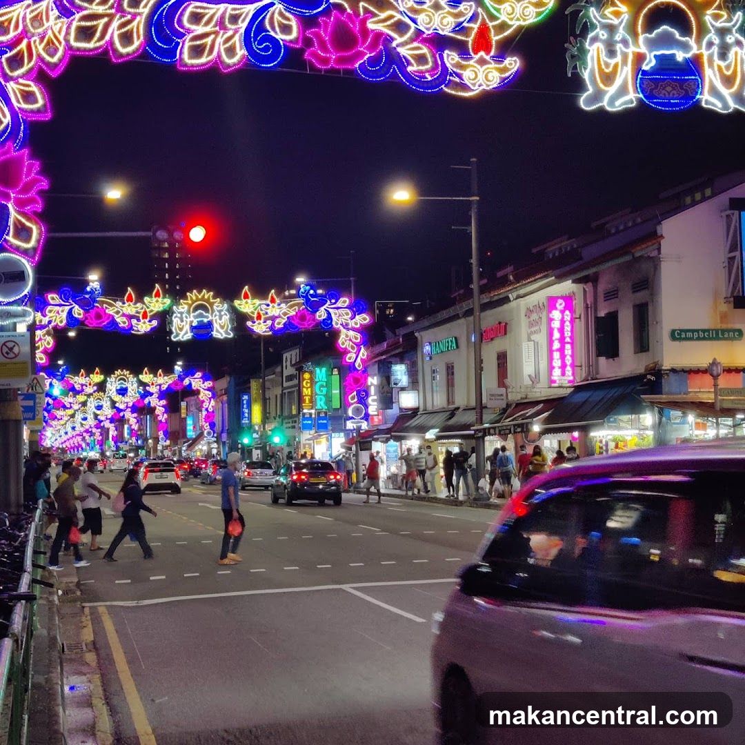 Street decorated with lights at night