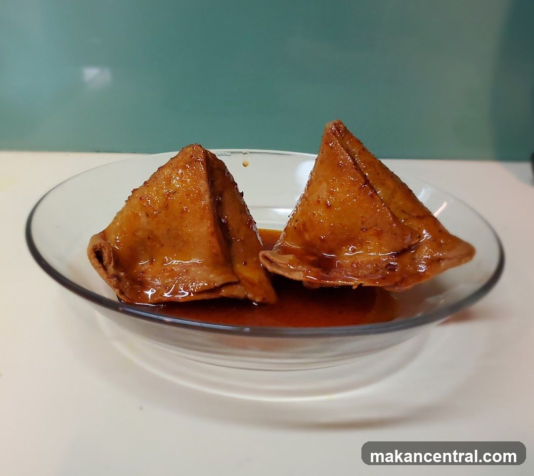 Two Samosas in a Bowl