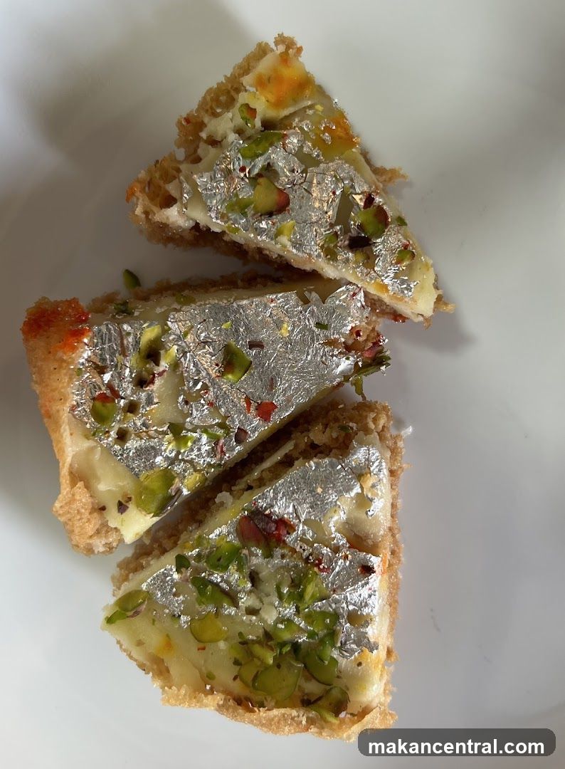 Slices of Indian Sweet with Edible Silver Leaf and Pistachios