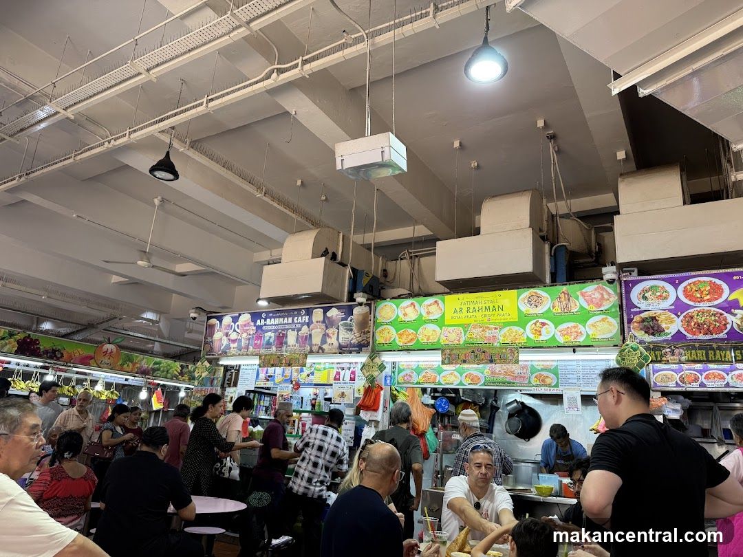 Busy Food Stall with Menu Boards