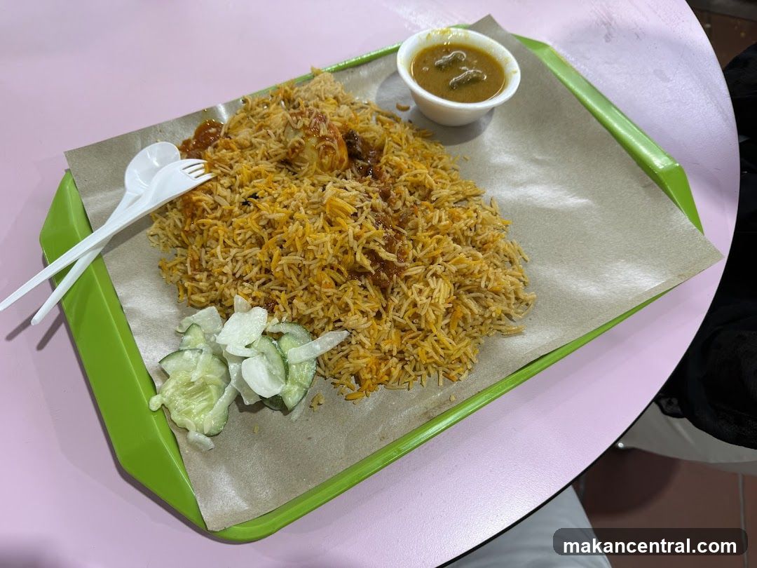 Biryani with side salad and curry