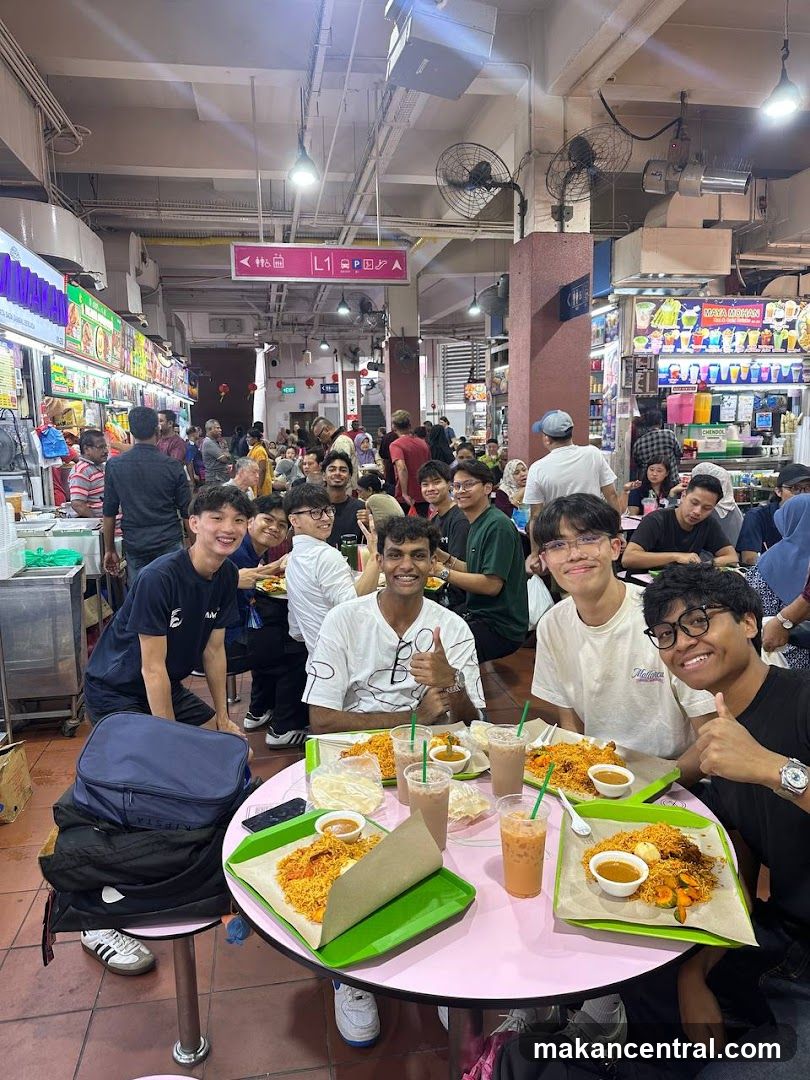 Group of friends enjoying a meal at a food court