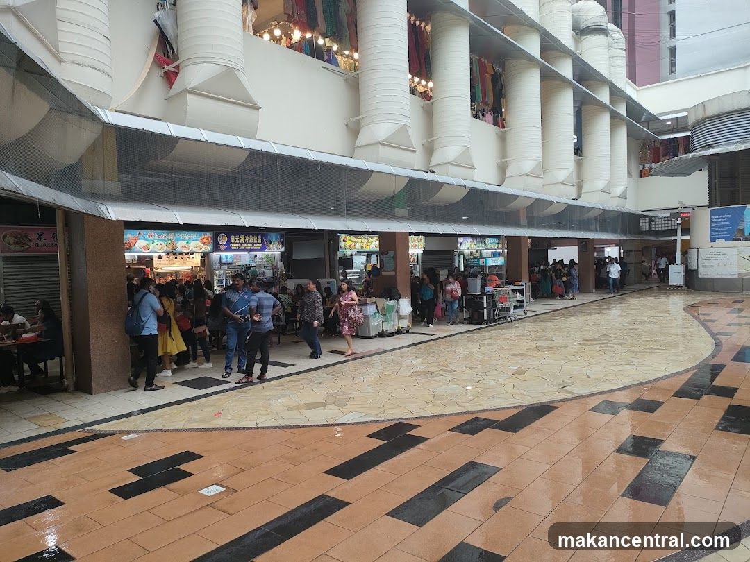 Outdoor Food Court with Stalls and Shoppers