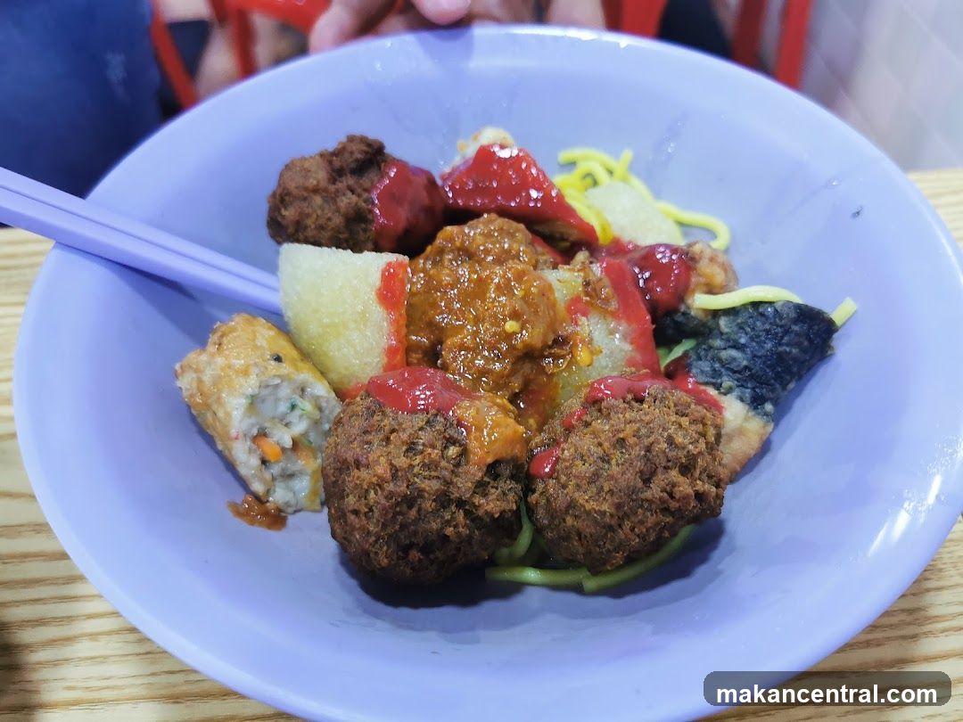 Bowl of Noodles with Various Toppings