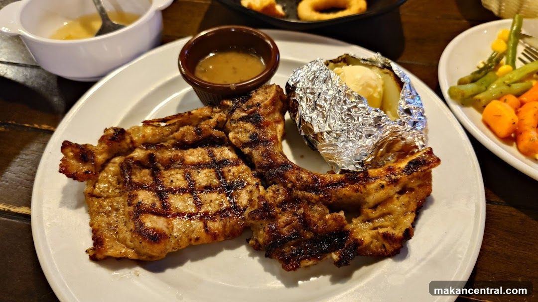 Grilled Pork Chops with Baked Potato and Vegetables