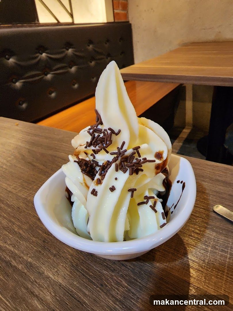 Soft Serve Ice Cream with Chocolate Sauce and Sprinkles