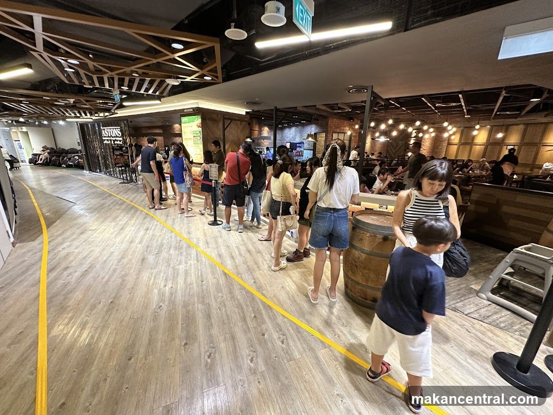 People queuing at a food establishment