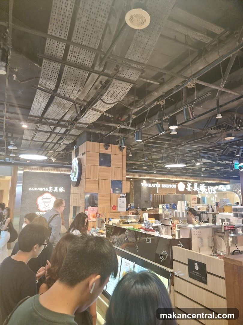 People queuing at a food stall