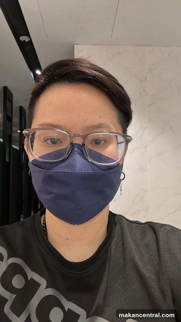Person wearing a mask and glasses