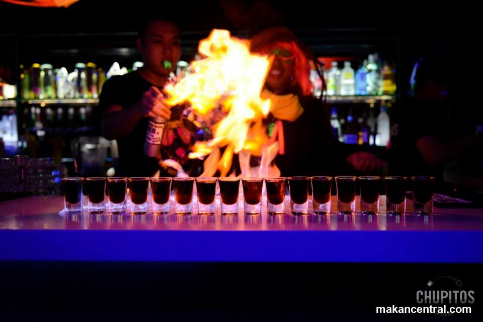 Bartender ignites flaming shots