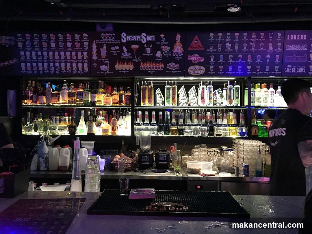 Bar with Shelves of Bottles and Menu Boards