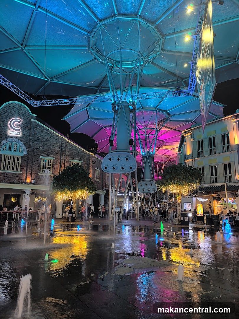Night Market with Fountains and Colorful Lights