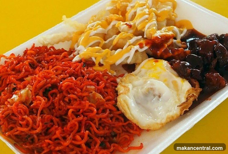 Spicy Noodles with Fried Egg and Meat