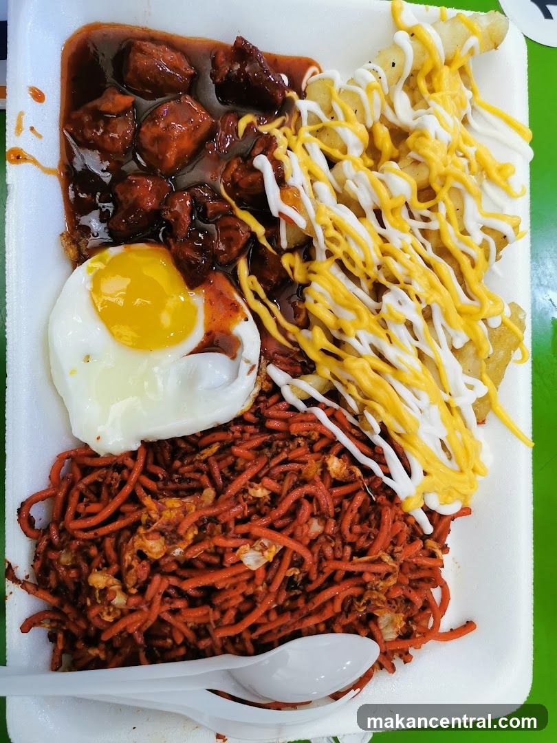 Meal with Noodles, Meat, Egg, and Fries