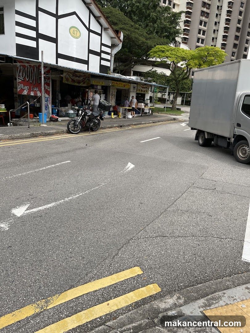 Street view of shops and a truck