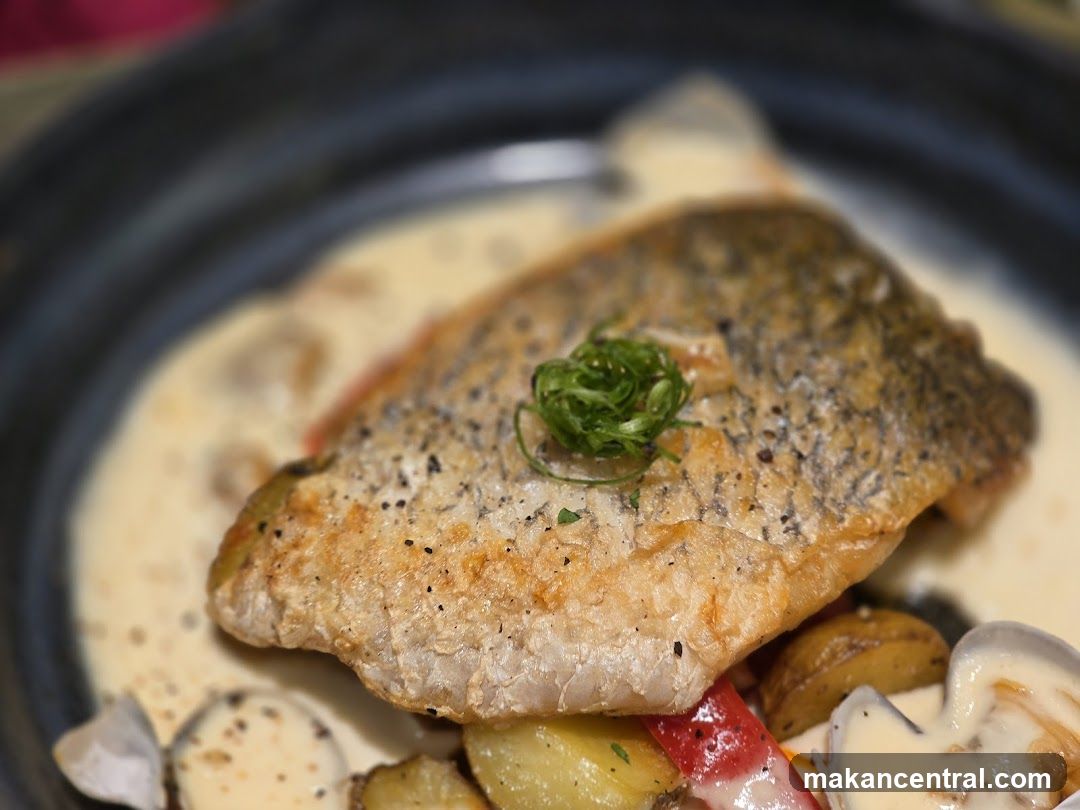 Fish dish with sauce and vegetables