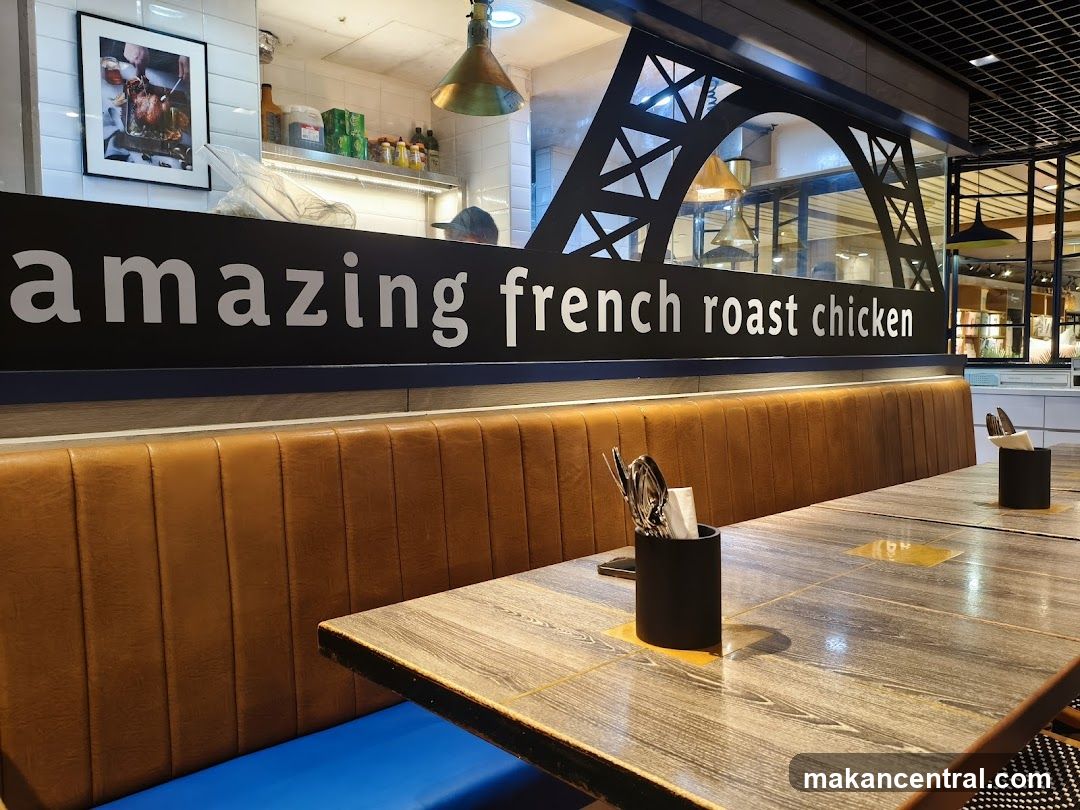 Restaurant Interior with "Amazing French Roast Chicken" Sign