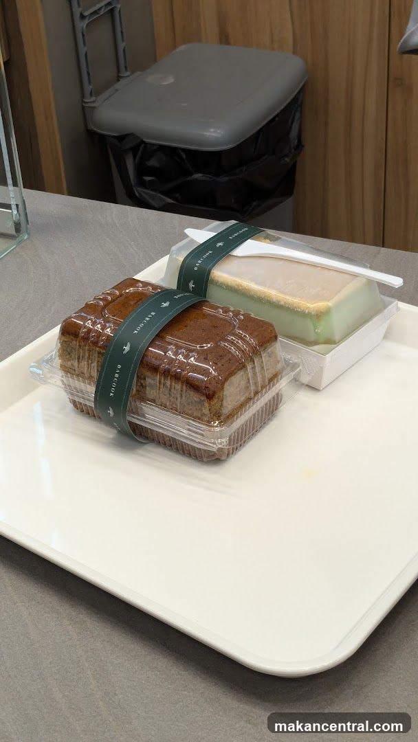 Two packaged cakes on a tray