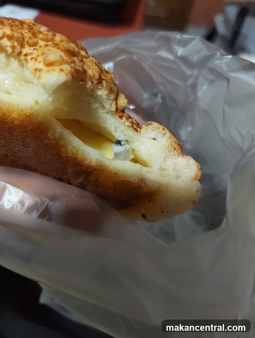 Cheese-filled bread with a foreign object