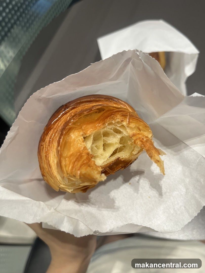Croissant in a paper bag