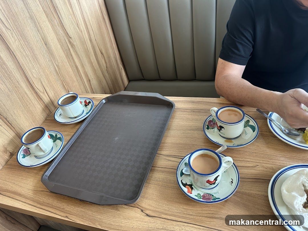 Coffee cups and tray on table