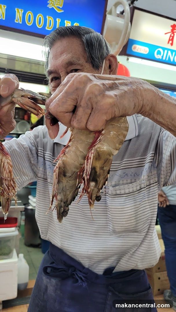 Man holding large prawns
