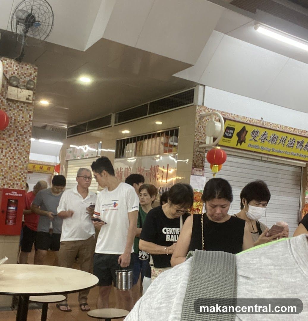 People in a food stall queue