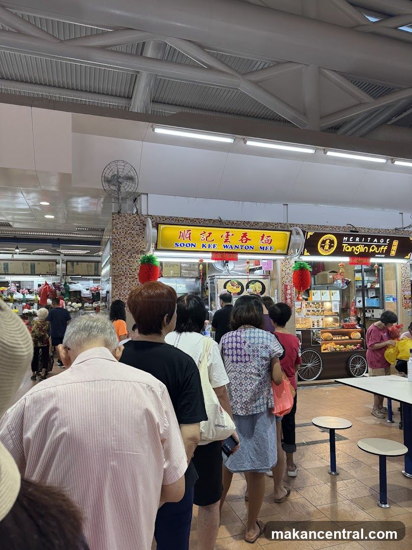 People queuing at a food stall