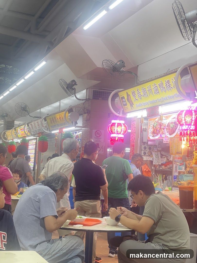 People eating at a food stall
