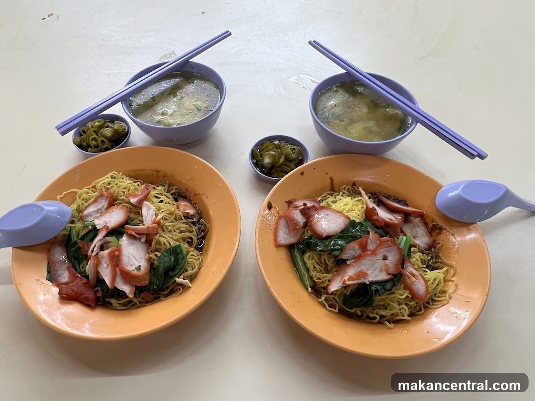 Two bowls of noodles with char siu