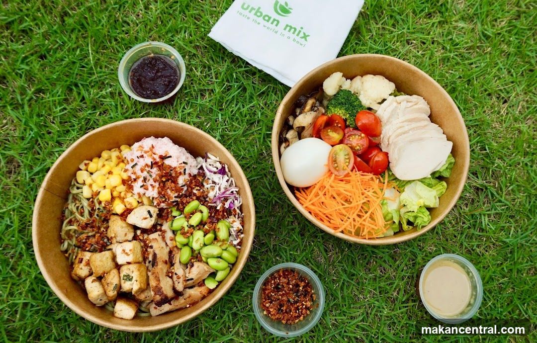 Two bowls of food on grass