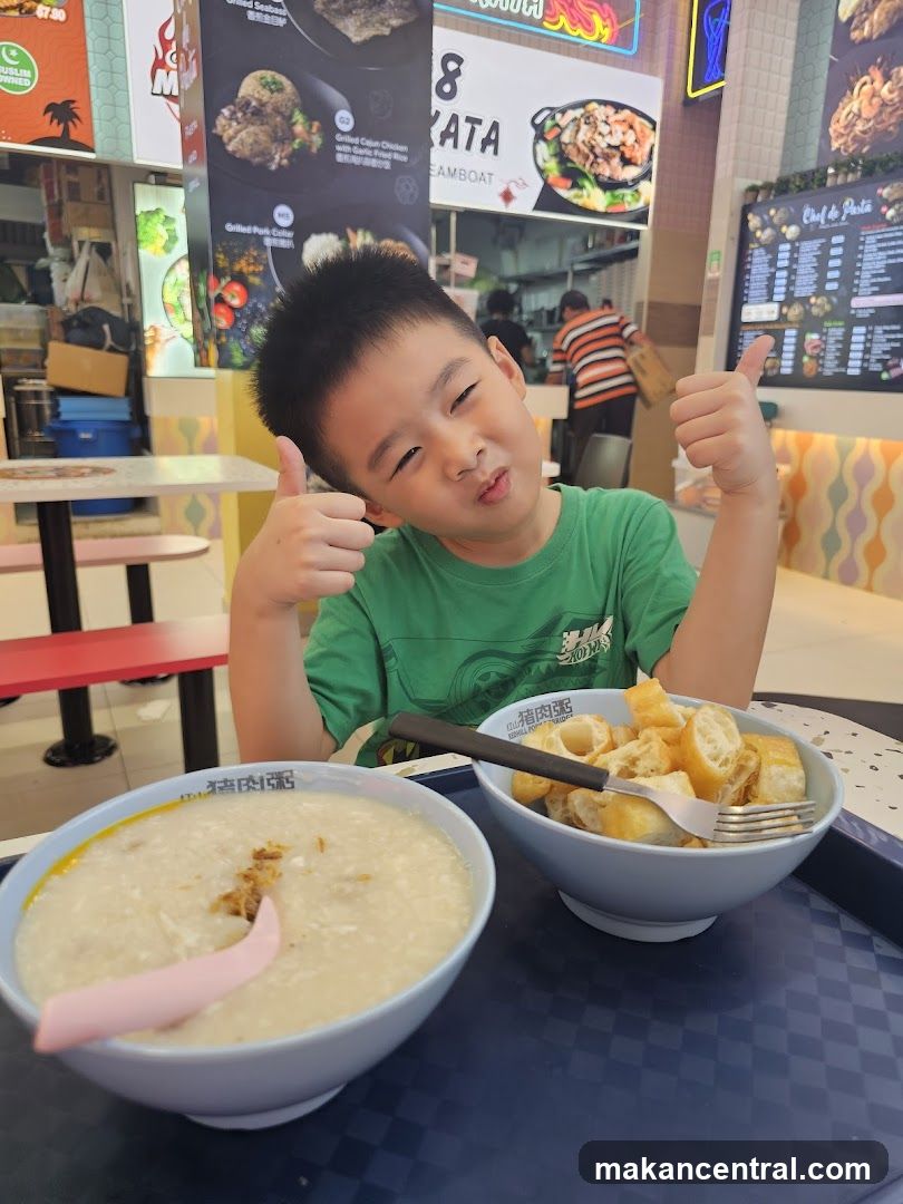 Boy Giving Thumbs Up with Food