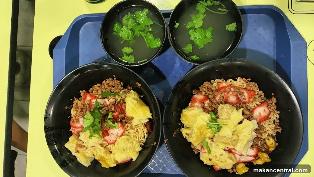 Two bowls of noodles with char siu and wontons