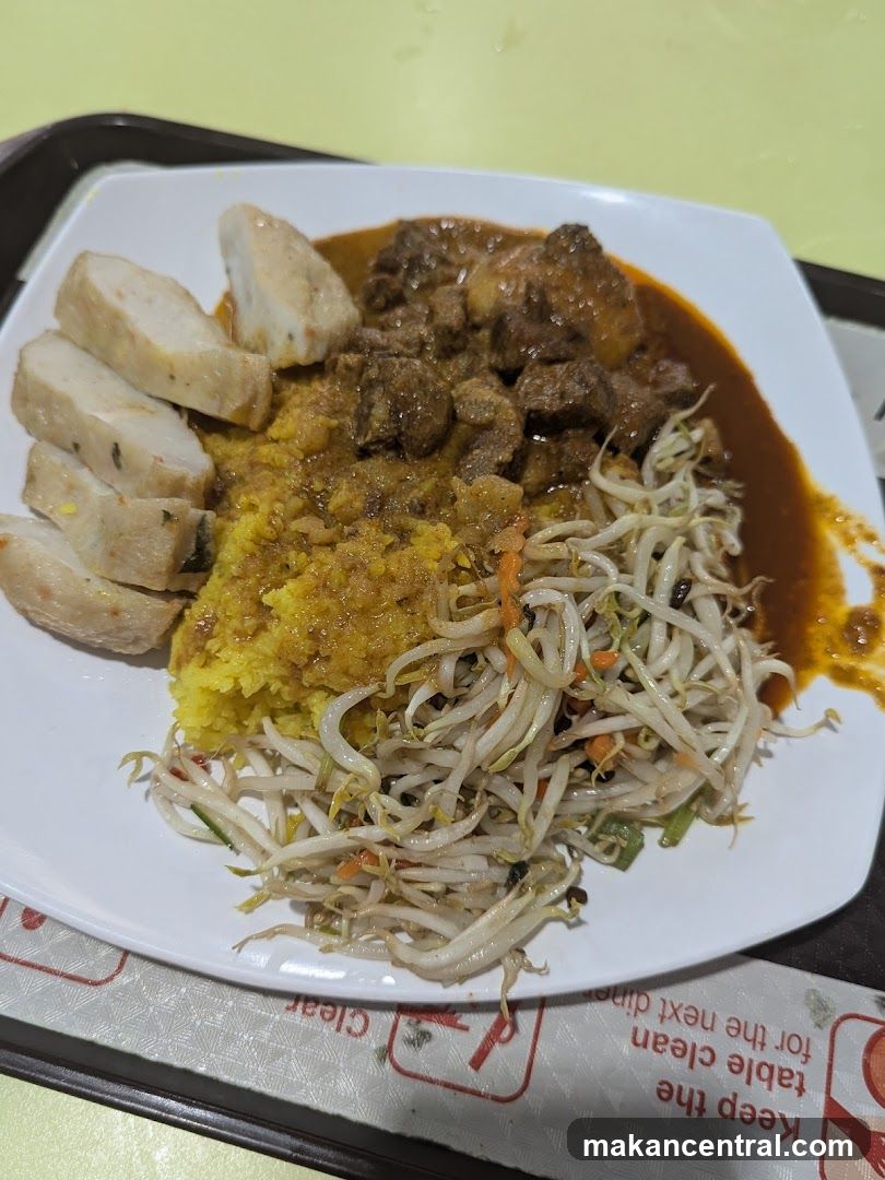 Plate of food with rice, meat, fish cakes, and bean sprouts