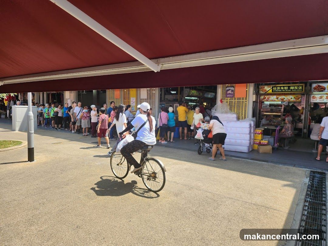 People queuing at a food stall