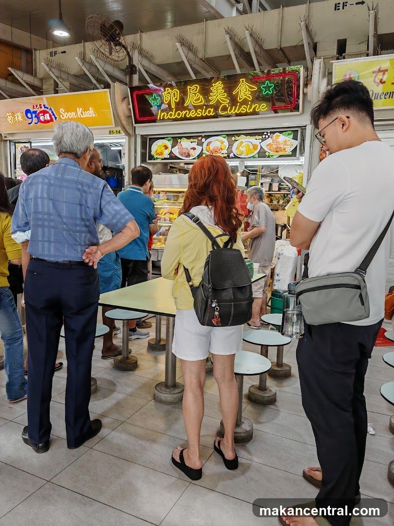 People queuing at a food stall