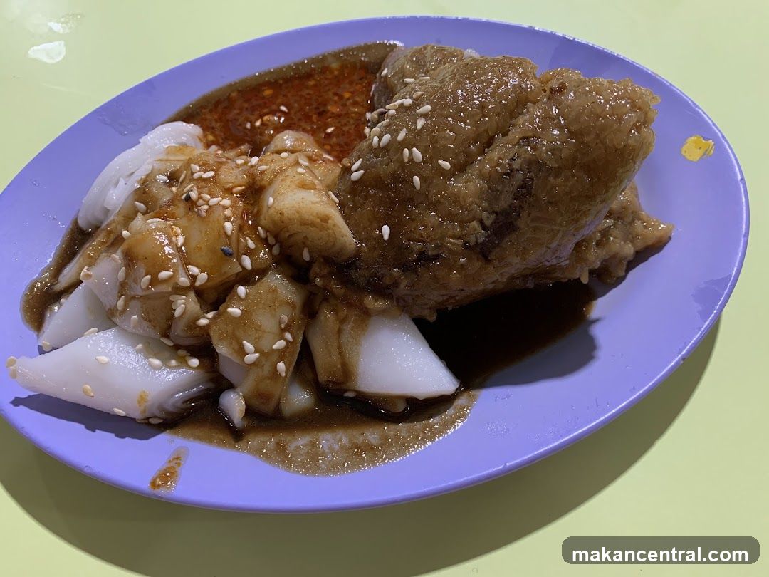 Steamed Rice Rolls with Savory Sauce and Sesame Seeds