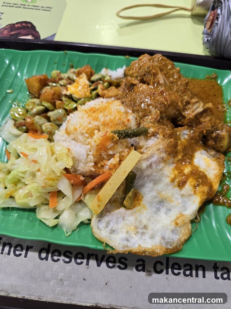 Rice plate with chicken curry and vegetables