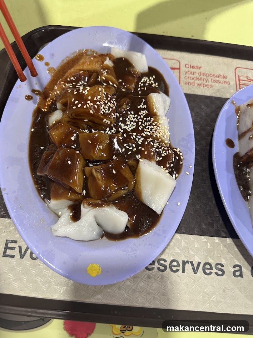 Chee Cheong Fun with Sauce and Sesame Seeds