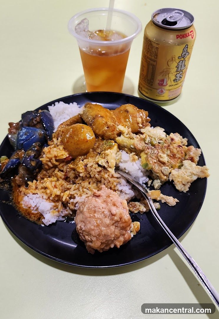 Rice plate with various dishes and a drink