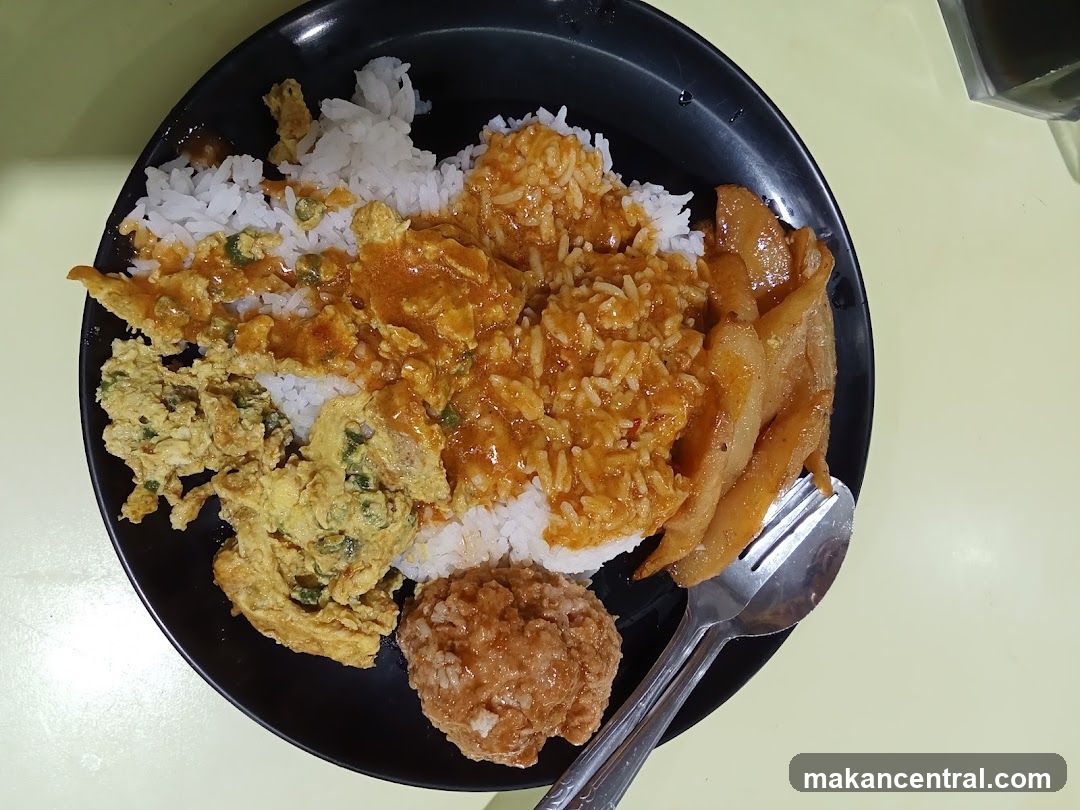 Rice dish with omelet and curry