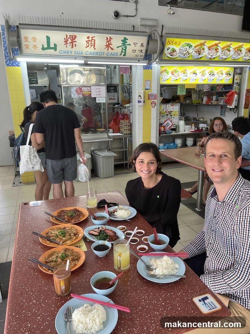 People Eating at a Food Stall