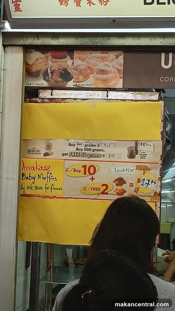 Food stall with pastries and promotions