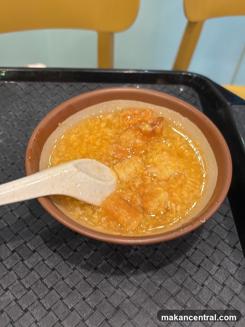 Bowl of Sweet Soup with Dough Fritters
