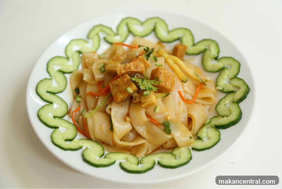 Noodle Dish with Cucumber Garnish